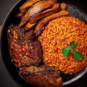 jollof rice platter with chicken (served with plantain and sliced cucumber )